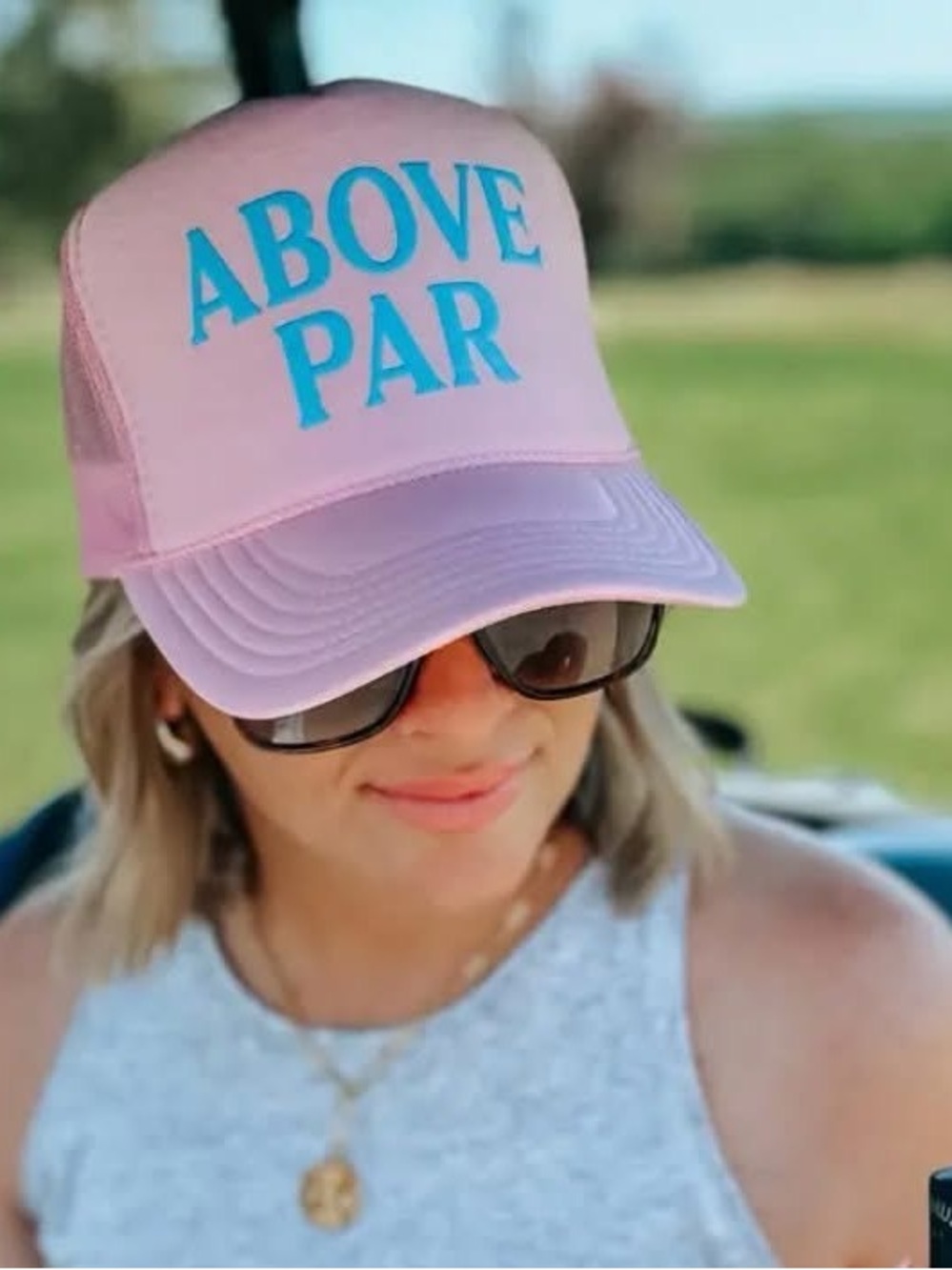 Above Par Pink Trucker Hat with Teal Lettering